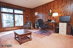 Generously sized, the den creates the opportunity for a second home office.
