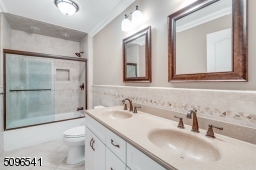 Dual sinks and frameless shower doors.