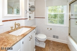Adjacent to Bedroom #4 on the first floor