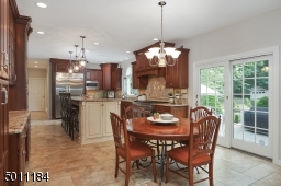 Every kitchen needs to have a walkout to the patio, be easily accessible through the rooms of the house and also be the heart of the home. All of these are here!