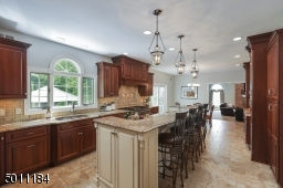 Super sunny, amazing windows, high ceilings and beautiful fixtures. Best part, there are is a deep pantry with roll out drawers!