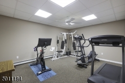 This is a finished room that can be used for any creative space.  Extra bedroom, home office, media room, craft room...you decide!