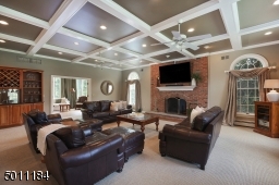 There is nothing like this room!  The coffered ceilings, fireplace, recessed lighting and space gives you a place to read, play game night or watch movies.