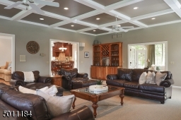 This huge room with wet bar is so perfect for entertaining!  With this open floor plan you have great flow to and from the conservatory as well.