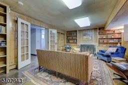 Pine paneled, slate flooring built in shelves and cabinets