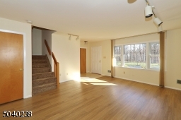 New Vinyl Flooring & Park-Like Views with Exit to Front