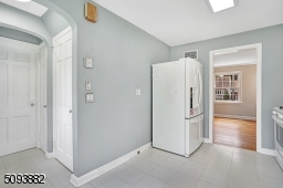 Eat-in kitchen w/ large bay window overlooks the beautiful backyard.