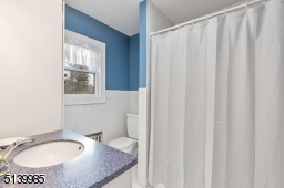Full bathroom that includes linen closet