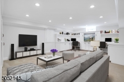 The finished Lower Level boasts a Recreation Room / Gym / Media Room with built-in cabinetry and work spaces plus phenomenal storage areas and extra full size refrigerator and freezer.