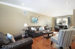 Formal living room  with gleaming hardwood floors