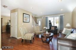 Formal living room  with gleaming hardwood floors