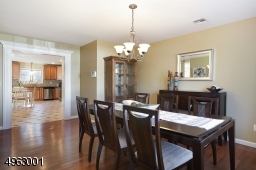 Formal dining room opens to a spacious kitchen