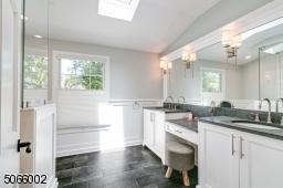 Marble Shower, Two Sinks & Center Vanity