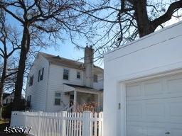 View of Garage and backyard; fully fenced yard