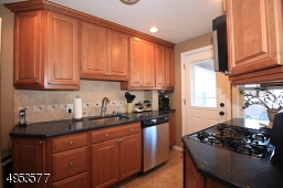 Updated Kitchen features plenty of cabinet space, undermount sink, dishwasher, newer garbage disposal