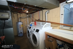 Newer front-load washer/dryer pair -- included in sale.  This portion of the basement also serves as a utility room/work shop.  Large window for natural light