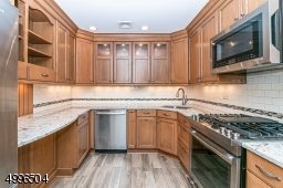 Beautifully updated kitchen with amazing cabinet space, quartz countertops and s/s appliances.