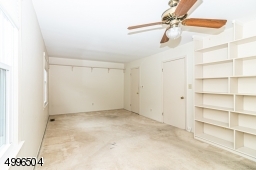 Great size room with walk-in closet and built in shelving.