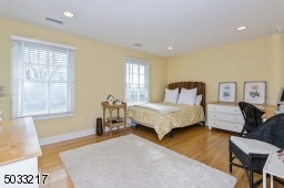Spacious sun filled bedroom with ensuite bath