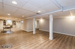 Spacious basement is finished and ready for your touch.  Closets, utility room and office space with built in cabinetry and wine cellar.