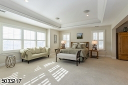 Sun Drenched master bedroom  with plantation shutters