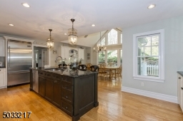 Beautiful custom cabinetry and hardwood floors throughout this fabulous kitchen
