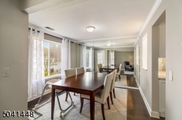 Dining Room features include mirrored wall and crown molding.