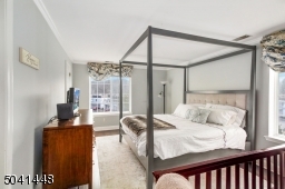 Sun-lit master bedroom with huge 5'X8' walk-in closet with "California" built-ins.