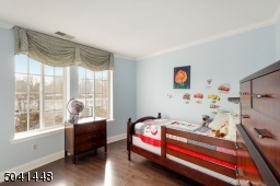 Cheery second bedroom on main level with deep closet.