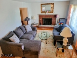 Living room with wood burning fireplace