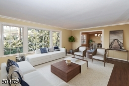 Opens into formal Dining Room and has access out to all season sunroom and private fenced backyard