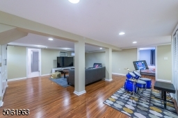 The finished lower level offers plenty of space for a gahering, game or media room. A fifth bedroom and full bath complete the level.