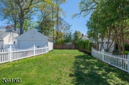 This fenced in lush yard make play (and doggy) dates worry free.