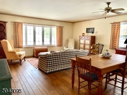 Bow Window. Random Width Wood Flooring