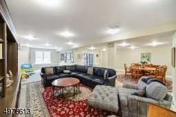WITH VIEW OF GAME ROOM, WINDOWS,  AND SLIDING DOORS TO PATIO AND LAKE