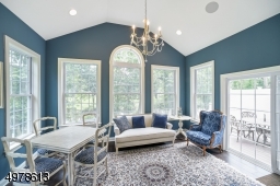 OFF OF FAMILY ROOM WITH 3 SIDED VIEWS OF LAKE AND GOLF COURSE AND SLIDING DOORS TO DECK WITH BUCOLIC VIEWS