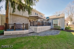 Composite 2 tiered Deck with Awning and lower Patio.  BBQ Grill and Gas line.
