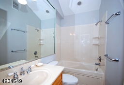 tub shower, maple vanity and a new comfort height toilet.