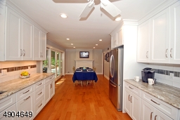 currently houses a table but could easily be converted back to the family room.