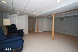 recreation room has new carpet, recessed lighting and plenty of closet space plus a powder room and laundry room.