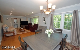 A nice open floor plan allows for extra seating during holiday dinners. The double window and maple flooring complete the room nicely.