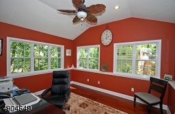 is currently being used as an office. High ceilings, walls of windows and gleaming hardwood flooring are just some of its special features. There is also a French door leading to the patio and is just steps away from the kitchen