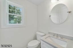 Powder room 1st floor off the mud room.