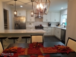 Spacious kitchen with island that seats 4. lots of light!