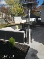 Patio and backyard with oversized shed