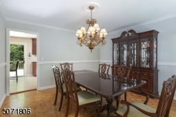 Dining Room with parkay floors and decorative.
