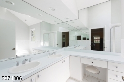 Stall shower and recessed lighting.