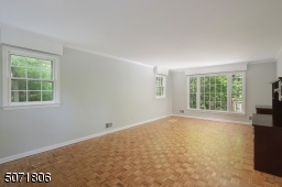 Parkay floors, decorative molding and picture window.
