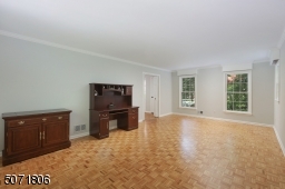 Parkay floors, decorative molding and picture window.