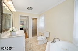 with Stall Shower, and Jetted Tub